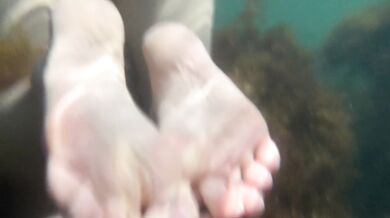 Naked girl swims in the sea and masturbate underwater