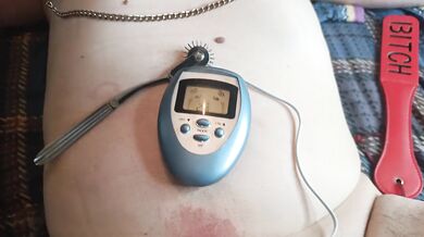 BDSM electro stimulation of dick in chastity belt, play with nipples.