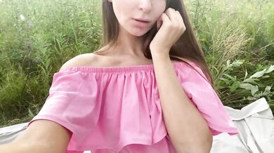 Young slut in pink dress masturbates outdoors