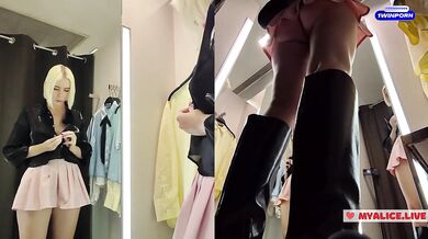 Upskirt view on Blonde with big boobs tries on transparent clothes. Video from public locker room