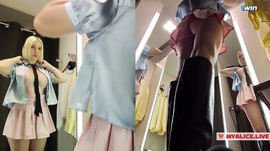 Upskirt view on Blonde with big boobs tries on transparent clothes. Video from public locker room