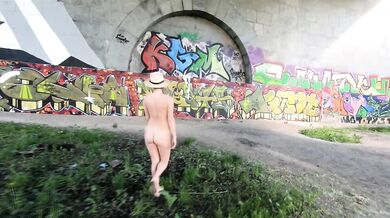 An exhibitionist Girl walks on the Moscow River Nudist Beach Serebryany Bor