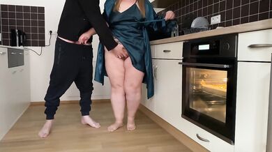 Horny mother-in-law and son-in-law masturbate together in the kitchen