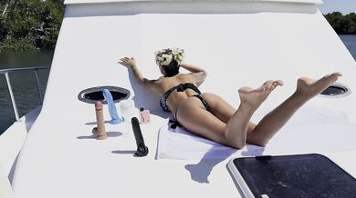 Stunning Monika Foxxx masturbates and plays with big dildo on yacht