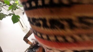 Giantess Nina steps on a small man with her feet