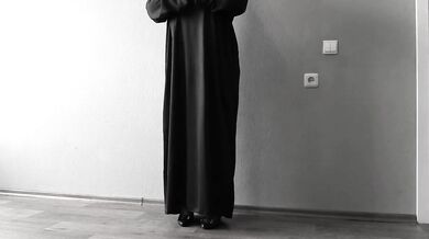 The nun is a mature bbw with big saggy tits.