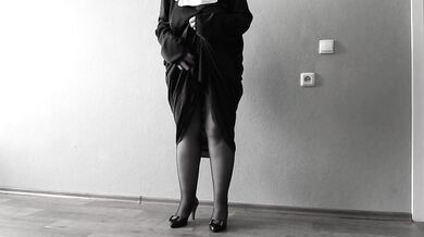 The nun is a mature bbw with big saggy tits.