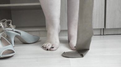 I put on nylon tights and try on high-heeled shoes.