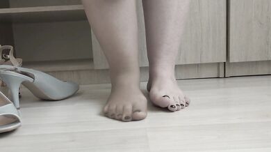 I put on nylon tights and try on high-heeled shoes.