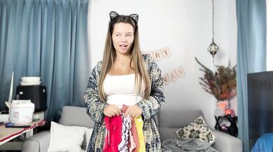 A beauty with big boobs tries on panties and shows off her pussy
