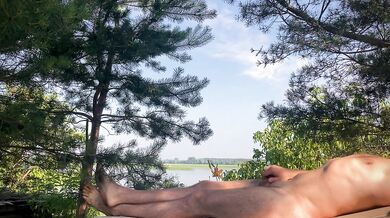 A warm breeze gently blows over him, and he smoothly moves the skin on his cock...