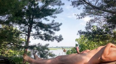 A warm breeze gently blows over him, and he smoothly moves the skin on his cock...