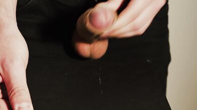 Thick uncut dick growing in black jeans. Natural foreskin. Cum on black plate.