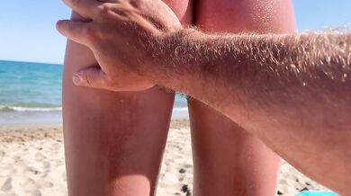 Risky Handjob on Public Beach