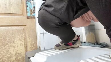 Mature milf pees in a hospital public toilet