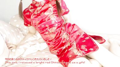 A girl in a red Chinese dress masturbates with a toy and a dildo She cums in her virgin pussy