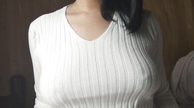 A Japanese woman with big breasts wearing a sweater given to her by a viewer and doing nipple mastur