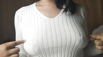 A Japanese woman with big breasts wearing a sweater given to her by a viewer and doing nipple mastur