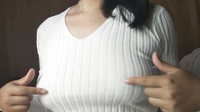 A Japanese woman with big breasts wearing a sweater given to her by a viewer and doing nipple mastur