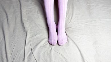 Pink socks in hands of mistress with blue nails in solo video