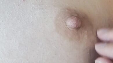 A hard, excited female nipple gets an orgasm from touching