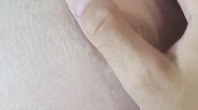 A hard, excited female nipple gets an orgasm from touching