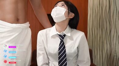 Japanese cosplayer gives a guy a handjob and cheekjob.