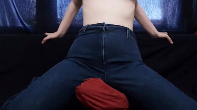 ASIAN GIRL IN BLUE JEANS RUBS PEETS ON PILLOW