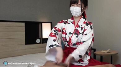 Japanese girl gives a guy a handjob wearing Japanese traditional kimono