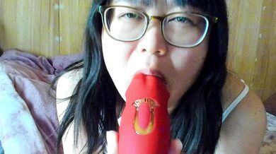 A Japanese woman masturbates her nipples with a toy she licked herself and climaxes.