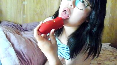 A Japanese woman masturbates her nipples with a toy she licked herself and climaxes.