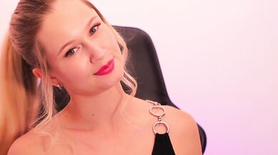 A beauty with red lipstick sucks her finger