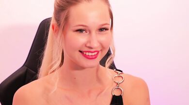 A beauty with red lipstick sucks her finger