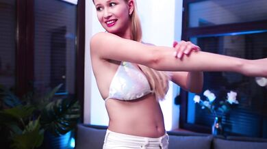A beauty with BIG EYES dances in a bikini