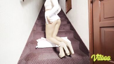 My girlfriend is wearing high heels and a white miniskirt