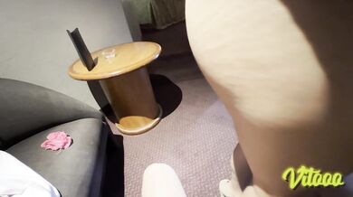 My girlfriend is wearing high heels and a white miniskirt