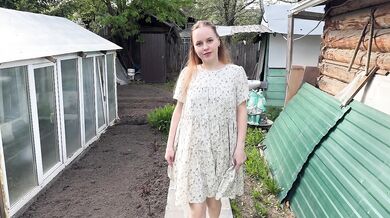 A beautiful Russian girl has sex outdoors in the village.