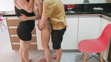 While the WIFE is washing the dishes, the FRIEND shows her vagina to the HUSBAND.