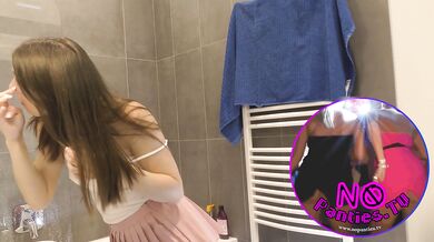 Braless hot brunette skinny and horny babe in a pink mini skirt to show her beautiful ass and legs