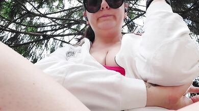 Smoking in a public garden tits outside and feet in flip flops