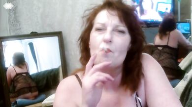 Redhead smoking in black babydoll nightie