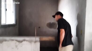 A BRICKLAYER IN THE MIDDLE OF THE CONSTRUCTION SITE