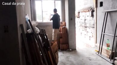 A BRICKLAYER IN THE MIDDLE OF THE CONSTRUCTION SITE