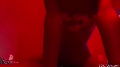Interracial sex filmed in a dimly lit brothel