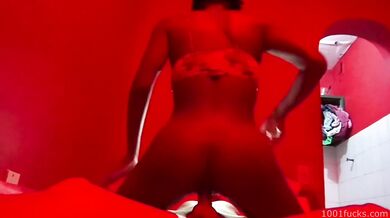 Interracial sex filmed in a dimly lit brothel