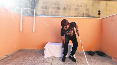 Blind man has a lucky day sitting in a public place.