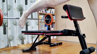 Japanese busty MILF masturbates on fitness bench