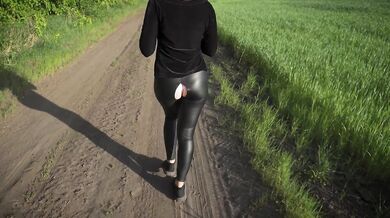 Girl Walking Outdoor In Ripped Leather Leggings