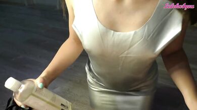 A brunette in a sexy dress gently and passionately jerks off a big dick in gloves