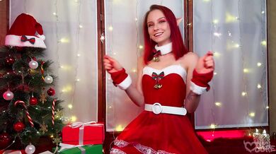 Christmas elf girl sweetly playing with her ass